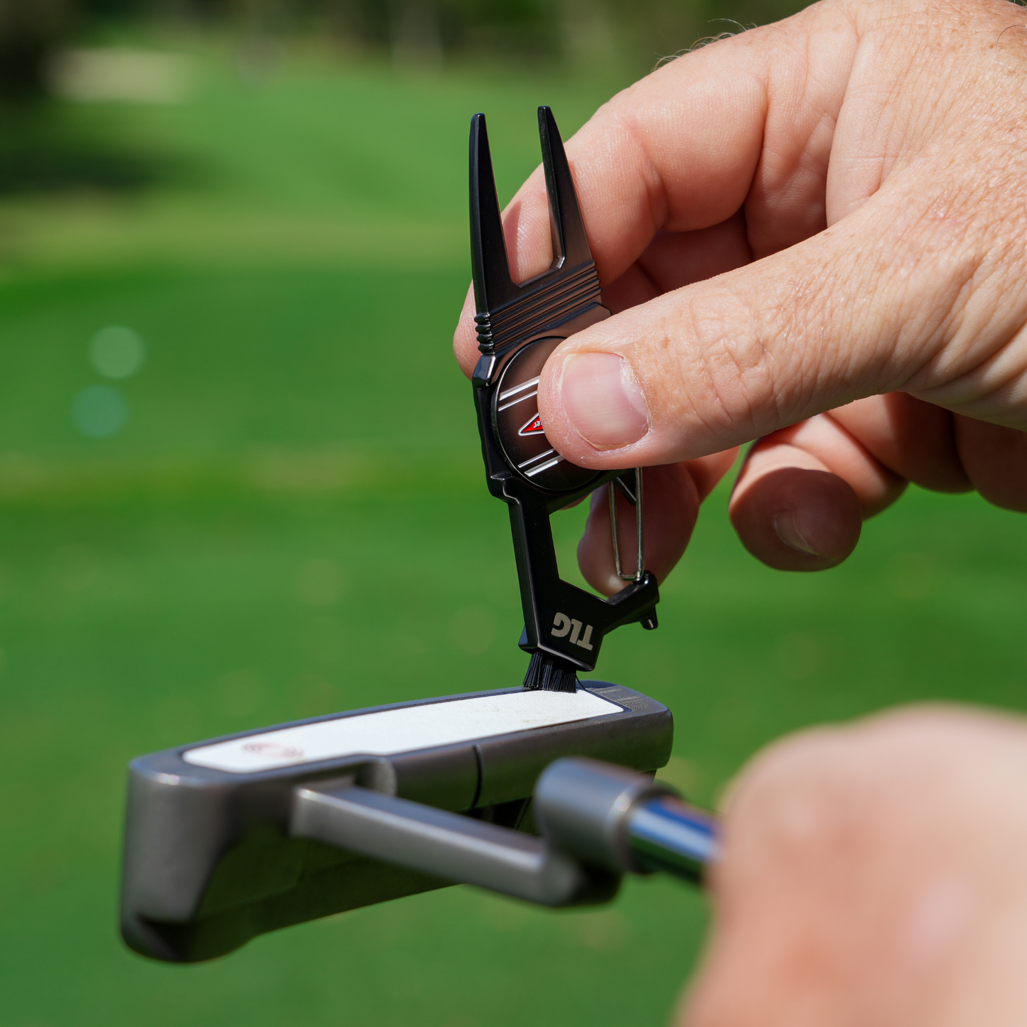 Sturdy metal multi-function divot tool golf with ball marker, spike tightener, brush cleaner, divot repair, beer opener, clip on belt or golf bag The Lucky Golfer