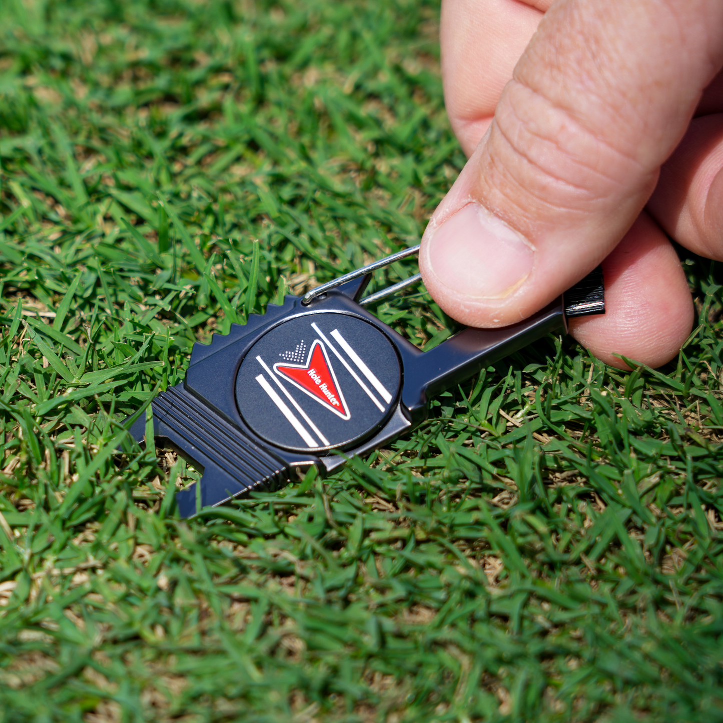 Sturdy metal multi-function divot tool golf with ball marker, spike tightener, brush cleaner, divot repair, beer opener, clip on belt or golf bag The Lucky Golfer