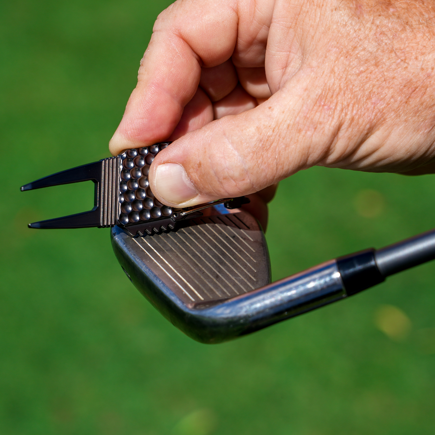 Sturdy metal multi-function divot tool golf with ball marker, spike tightener, brush cleaner, divot repair, beer opener, clip on belt or golf bag The Lucky Golfer