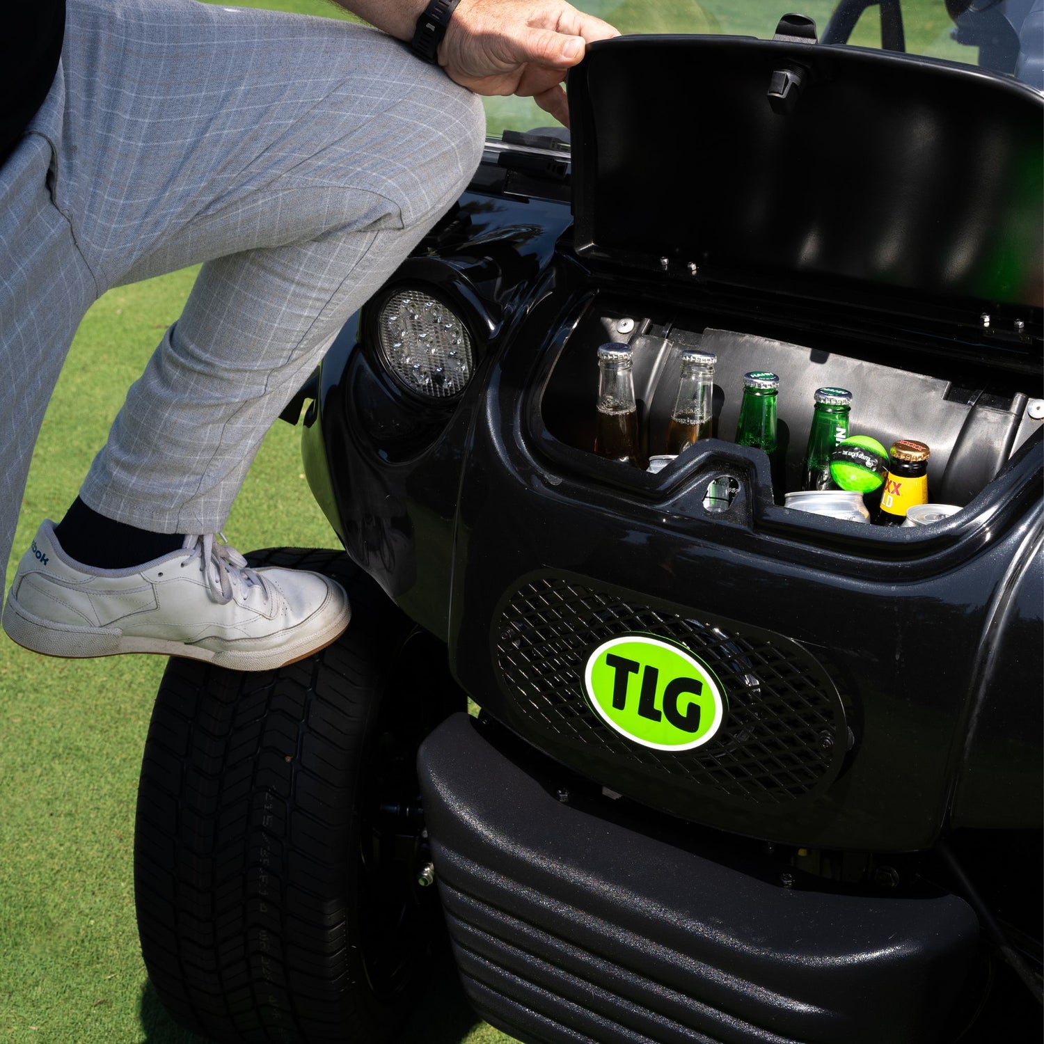 Man with beers in golf buggy esky The Lucky Golfer